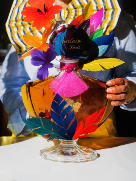 Image may contain Food Food Presentation Flower Flower Arrangement Plant Cream Dessert Sundae Person and Glass